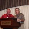 President John McCormick presents a plaque to past President, Fred Dickinson.