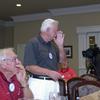 Ed Cluck, bravely gives the Arkansas team report.